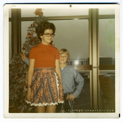 Vintage 1970s color snapshot of 2 kids at Christmastime