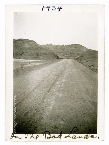 Vintage '30s snapshot of lonesome road in The Badlands