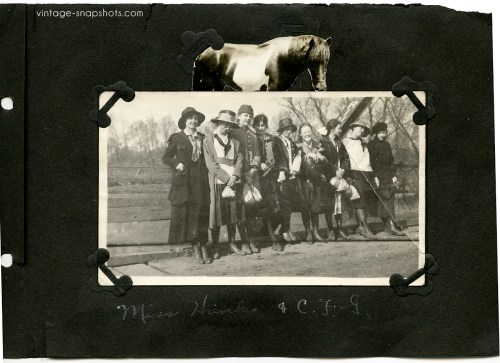 Photo album page containing vintage snapshot of women with a cut-out horse pasted above