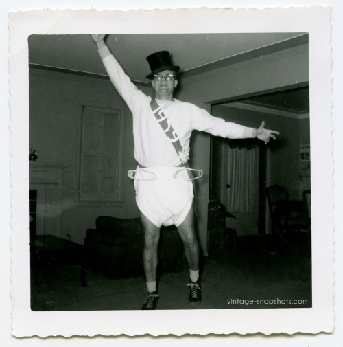 Vintage 1959 snapshot of man celebrrating New Year's in 1959 by wearing a giant diaper