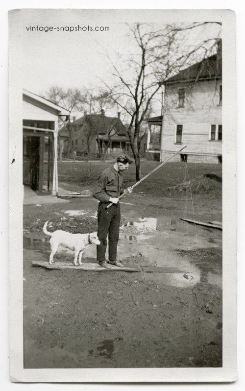 Funny vintage snapshot featuring an and dog "fishing" in what seems to be a backyard