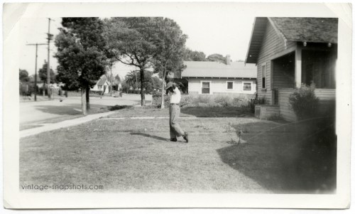 1940s/'50s snapshot photograph of black boy in baseball pitching pose